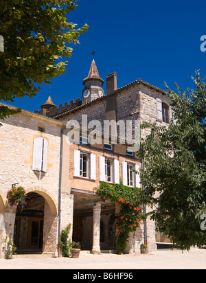 Old medieval buildings and the clock tower of L'Eglise St Andre in Monflanquin, Lot et Garonne, France Europe Stock Photo
