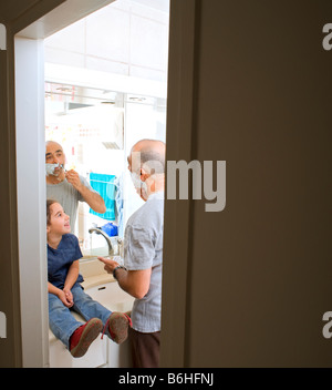 Girl shaving her father in the bathroom Stock Photo - Alamy