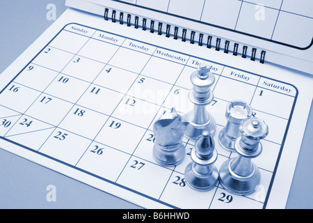 Chess Pieces on Calendar Stock Photo