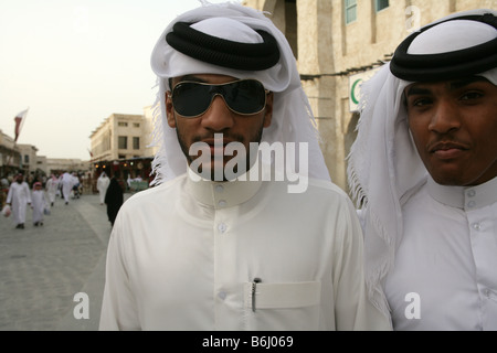 Qatari men in traditional clothing at the Souq Waqif market, head and shoulders portrait, Doha, Qatar, Middle East Stock Photo