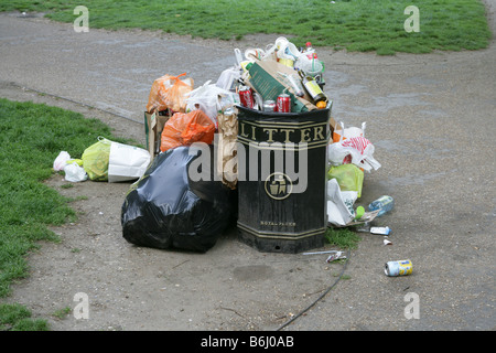 An overflowing litter bin at Hyde Park, London. Stock Photo