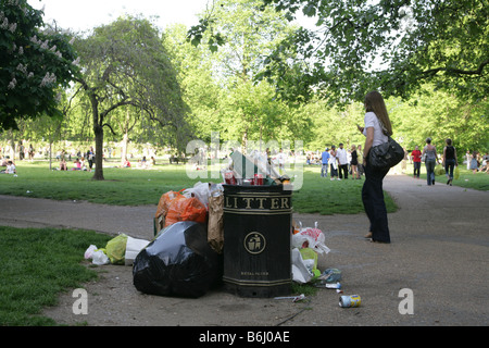 An overflowing litter bin at Hyde Park, London. Stock Photo