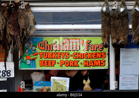 Sign in traditional butcher s shop at Christmas UK Stock Photo