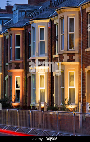 Terraced housing in a 1930s style on Belgrave Crescent opposite Ridley Park in Blyth, lit for the Blyth in New Light 2008 Stock Photo