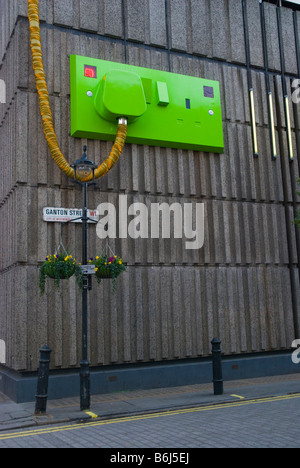 Giant electric plug in Soho in London England UK Stock Photo