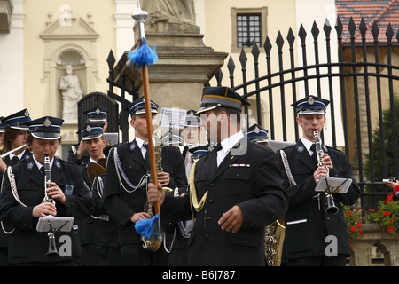 The conductor runs a brass band during a religious ceremony in Kalwaria Zebrzydowska, Poland Stock Photo