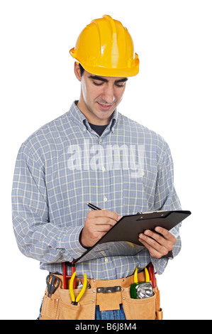Young construction worker taking noted a over white background Stock Photo