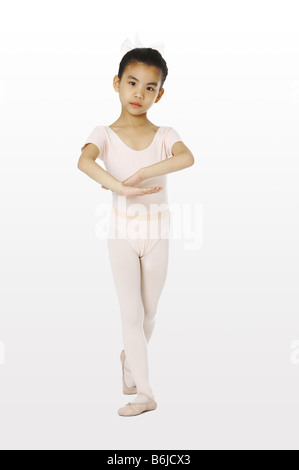 Girl in sports clothing performing gymnastic Stock Photo