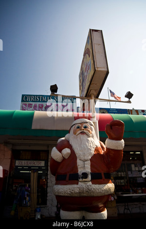 Store front of tacky tourist trap Christmas store featuring a large Santa sculpture in Pigeon Forge, Tennessee USA. Stock Photo