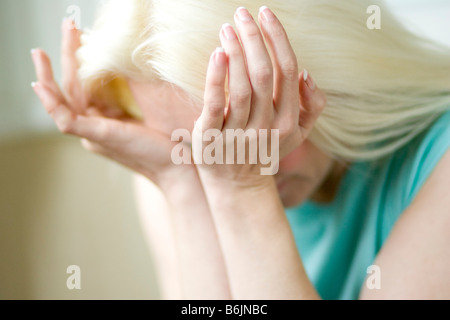 Girl rubbing eyes Stock Photo