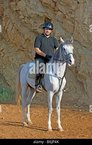 Man riding a horse Stock Photo