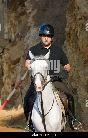 Man riding a horse Stock Photo