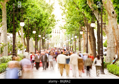 Blurred crowd in the street high key Stock Photo