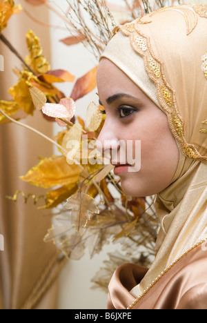 Profile portrait of a young Muslim girl wearing hijab Stock Photo