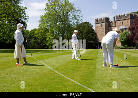 England, Somerset, Wells.  A game of croquet takes place on the lawns in front of the Bishops Palace Stock Photo