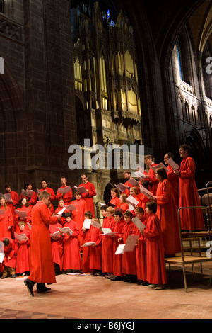 UK Cheshire Chester Cathedral Choir rehearsing before Christmas Carol Service Stock Photo