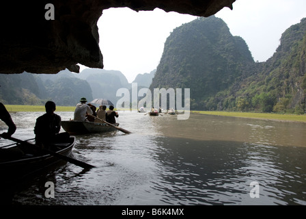 Tam Coc (Three Caves) on the Ngo Dong River, north Vietnam A boat ride on the Ngo Dong River Tam Coc, Vietnam Stock Photo