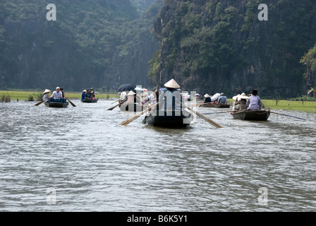 Tam Coc (Three Caves) on the Ngo Dong River, north Vietnam A boat ride on the Ngo Dong River Tam Coc, Vietnam Stock Photo