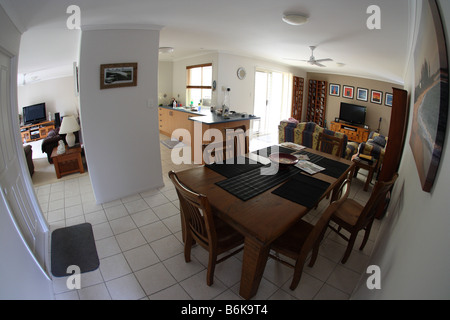 FISHEYE VIEW OF INTERIOR OF HOUSE INCUDING LOUNGE DINING AND FAMILY ROOMS Stock Photo