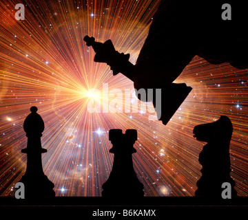 male hand moving chess pieces silhouetted on chess board digitally altered Stock Photo