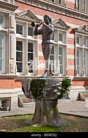 Pied Piper of Hamelin statue on fountain in town of Hamelin Germany Stock Photo