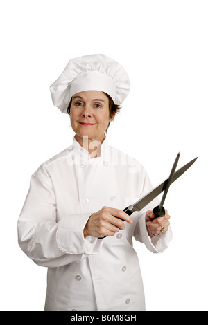 A female chef sharpening her knife Three quarter view isolated on white Stock Photo