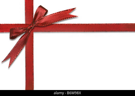 Christmas Gift Wrapped in Pretty Red Bow Isolated on White Background Stock Photo