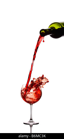 Red wine pouring down from a wine bottle Stock Photo