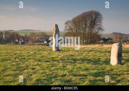 Avebury village seen along the Avenue leading to the neolithic Stone Circle Wiltshire Stock Photo