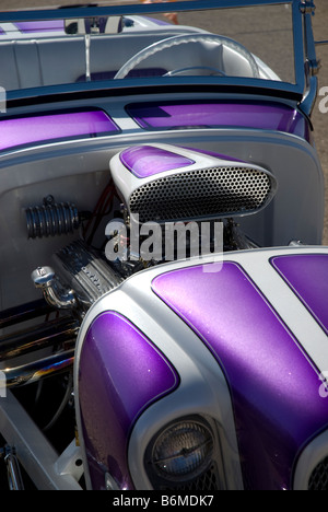 A photo showing the custom design work on the front of a purple hot rod. Stock Photo