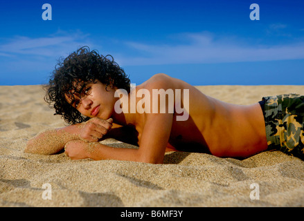 Ethnic Handsome Teenage Youth on the Beach Stock Photo