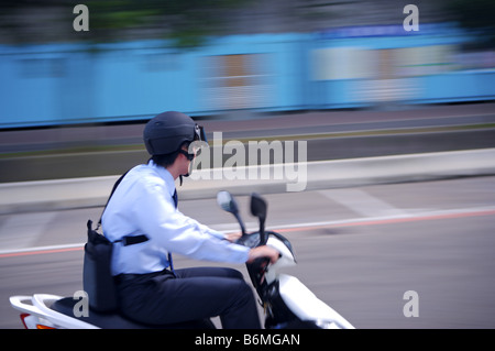 Young businessman riding motorcycle Stock Photo