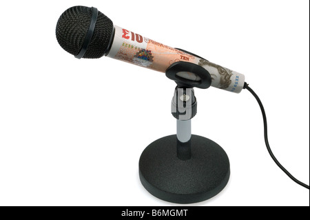 Money talks concept image of a ten pound note around a tabletop microphone isolated on a white background Stock Photo