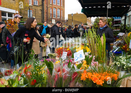 Columbia Road flower market during the Sunday market day in East London England UK Stock Photo