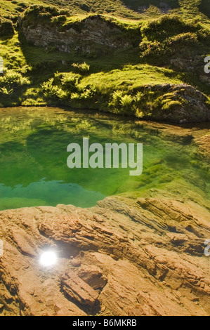 reflection of the sun in the water Stock Photo