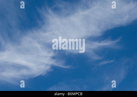 High altitude cirrus clouds against a blue sky Stock Photo
