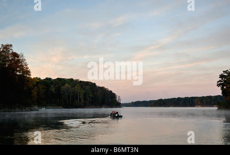 Fishermen Setting off in Boat at Sunrise on Cecil M Harden Lake in Parke County Indiana Stock Photo