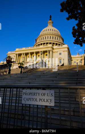 A view of the US Capitol Building in Washington D.C. with barricade fence and Capitol Police property sign in foreground Stock Photo