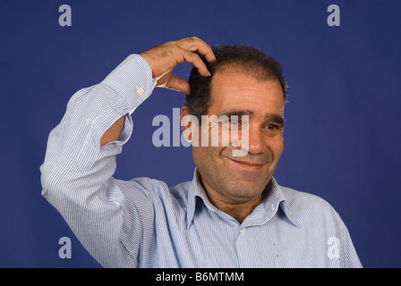 Man scratching his head Stock Photo