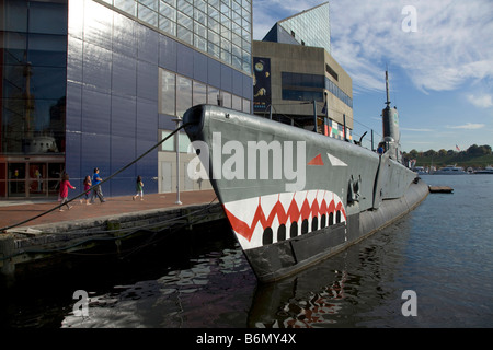 Old submarine docked in front of the National Aquirium in the Inner Harbor in downtown Baltimore Maryland Stock Photo