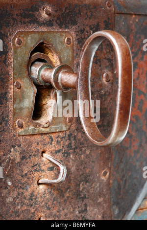 Keyhole in the old metal rusty chest Stock Photo