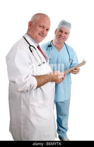 A vertical view of two friendly doctors reviewing a medical chart Isolated focus on doctor in white coat Stock Photo