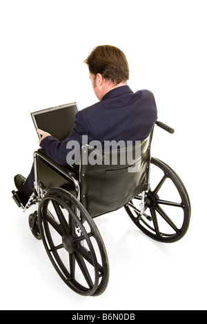 Disabled businessman in wheelchair working on computer Full body isolated on white Stock Photo