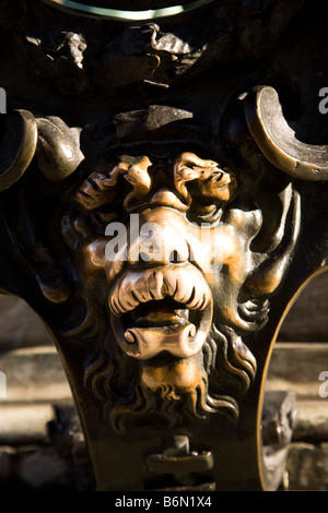 The brass face of one lions outside of the Residenz in Odeonsplatz, Munich, Germany. People touch the lion's nose for luck. Stock Photo