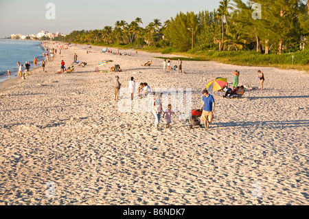 Naples Municipal Beach Naples Florida fl late afternoon sunbathers soft light white sand Stock Photo