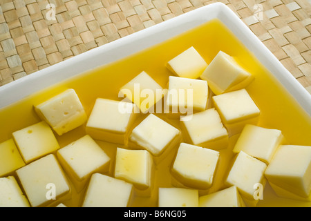 queso en aceite de oliva virgen extra cheese in extra virgin olive oil Stock Photo