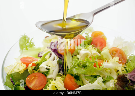 Extra virgin olive oil and salad typical of the Mediterranean diet ...