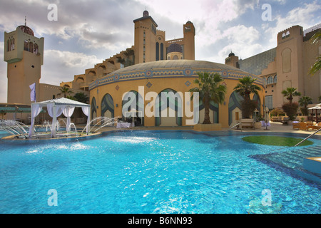 The best rest in magnificent hotel about picturesque pool Stock Photo