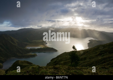 Aerial view of Fire Lake or Lagoa Do Fogo on the Portuguese Island of Sao Miguel in the Azores with strong sun beams shining, Stock Photo
