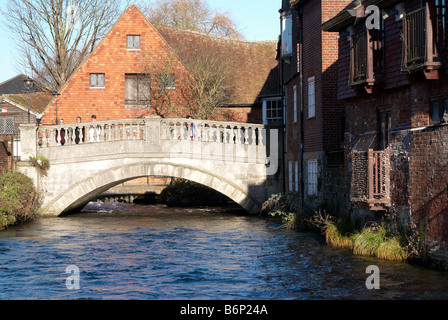 Winchester, Hampshire, England - River Itchen and City Bridge with the 18th century City Mill watermill behind. Stock Photo